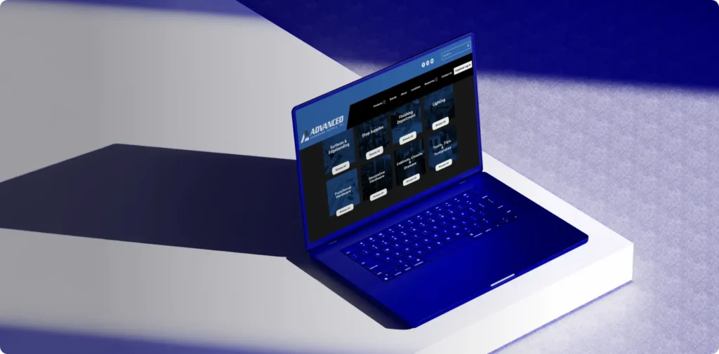 A desk with laptop showing Advanced Hardware Supply's new website