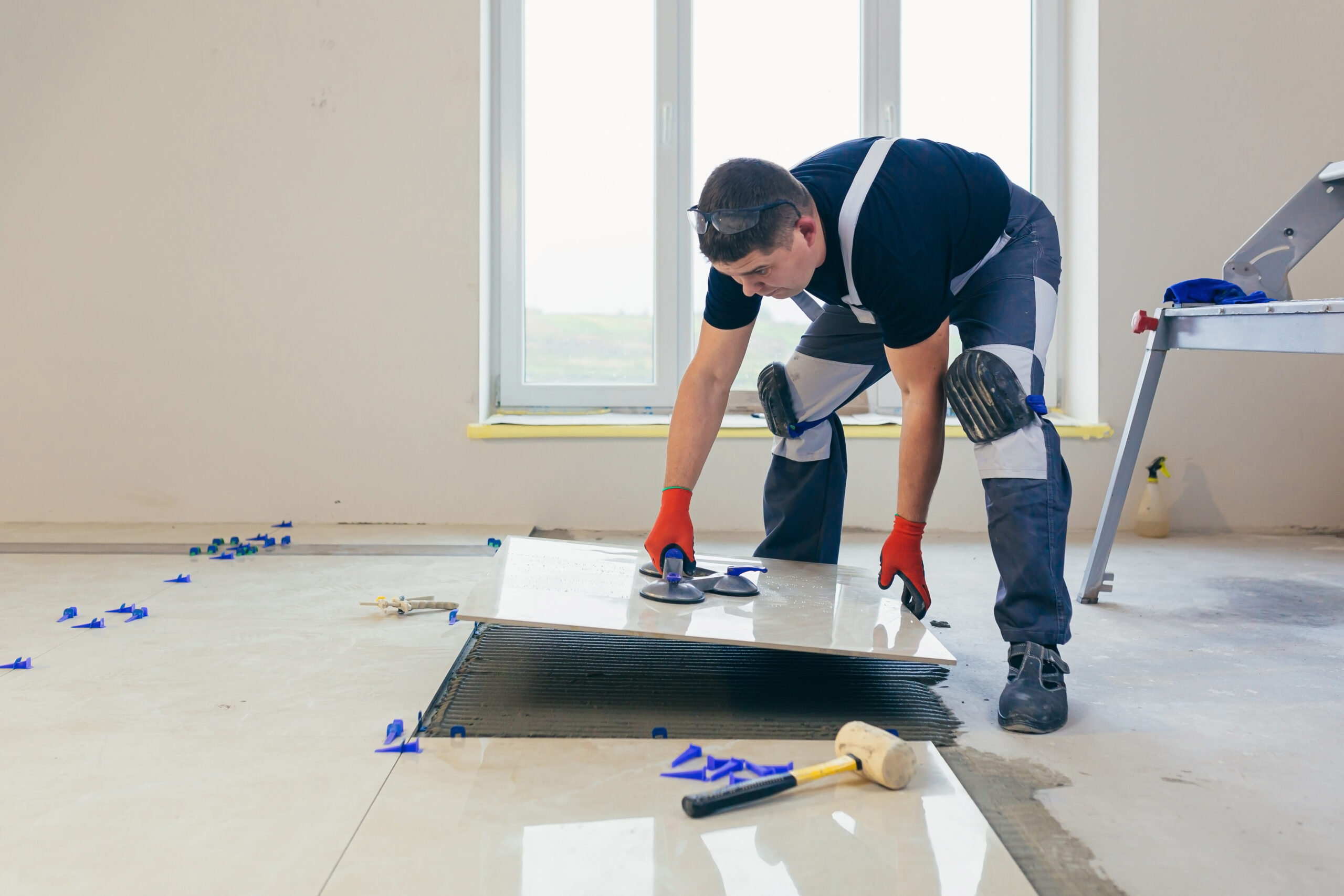 Professional flooring installers demonstrating the importance of an installer marketing strategy