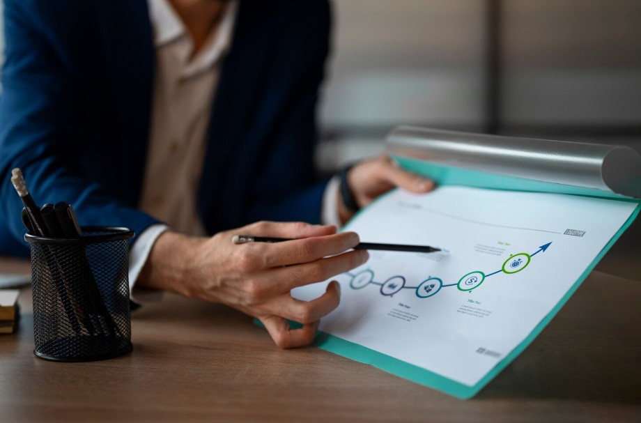 Professional analyzing business information and reviewing a documented process